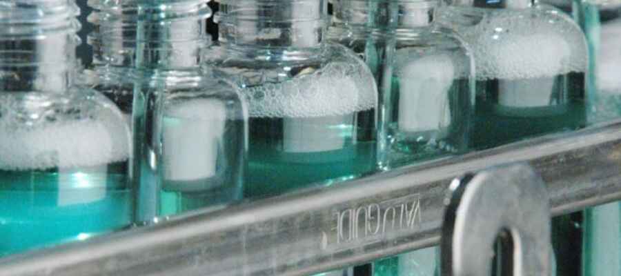 Blue liquid being packaged.